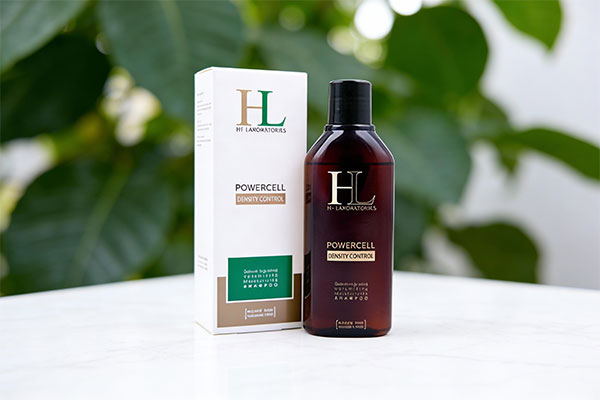 شامپو موهای چرب اچ ال HL روی سطح مرمری سفید