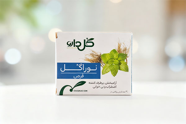 تصویر قرص نوراگل گل دارو روی سطح سفید