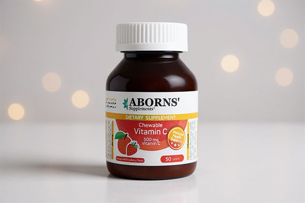 قرص جویدنی ویتامین سی ابورنز روی سطح سفید