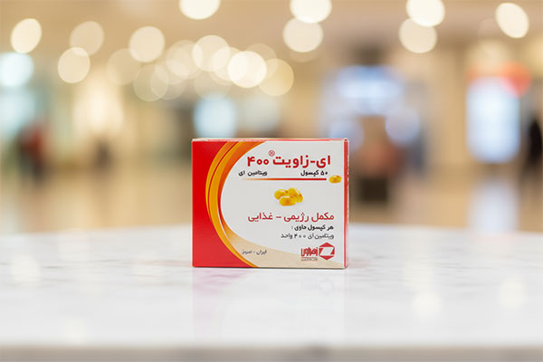 کپسول ای زاویت 400 زهراوی روی سطح مرمر سفید