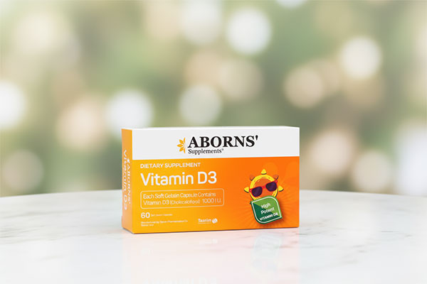 کپسول ویتامین D3 ابورنز 1000 واحدی روی سطح مرمر سفید