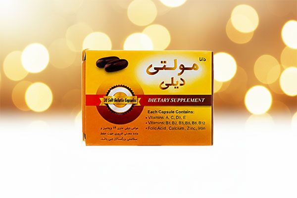 کپسول مولتی دیلی دانا روی سطح سفید
