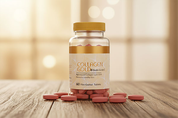 قرص کلاژن گلد بیوتین و ویتامین C آدریان روی سطح مرمر سفید