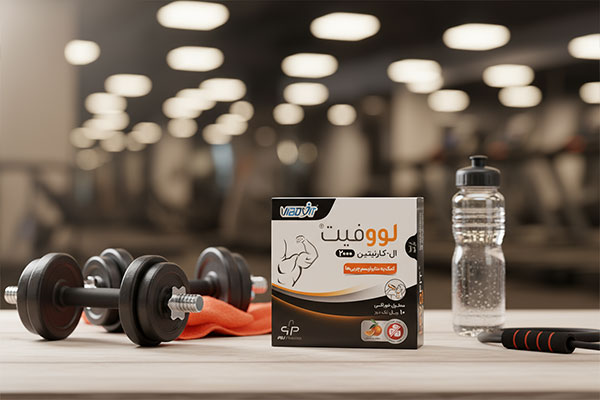 ویال ال کارنیتین مایع لووفیت 2000 در کنار تجهیزات ورزشی