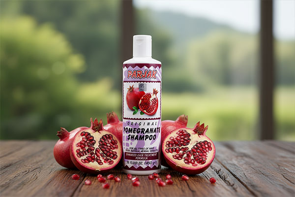 شامپو انار پرژک همراه با میوه انار تازه