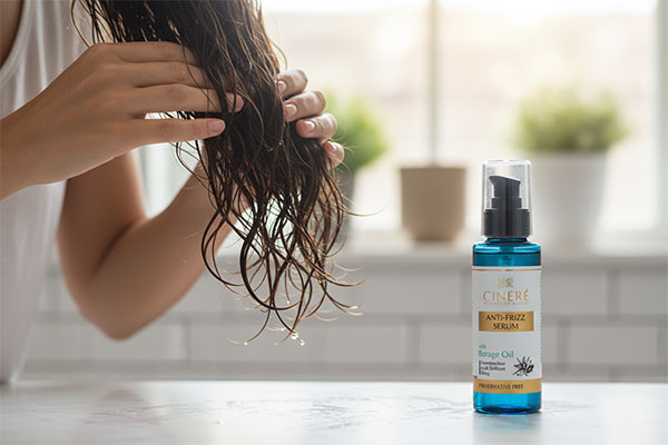 Applying hair serum for frizz control