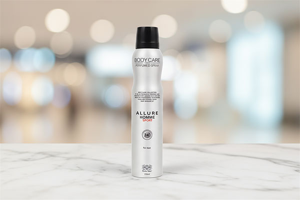 اسپری بدن مردانه آلور هوم اسپورت بادی کر روی سطح مرمر سفید