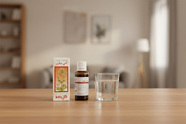 قطره ضد میگرن گل دارو کنار لیوان آب