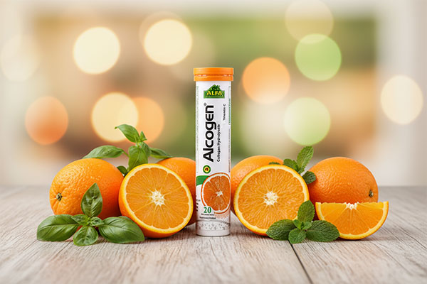 قرص جوشان آلکوژن آلفا ویتامینز با پرتقال و برگهای سبز
