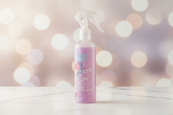 سرم دو فاز موهای نازک سریتا روی سطح مرمر سفید