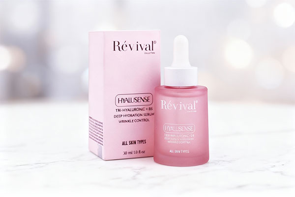 سرم آبرسان و روشن کننده پوست رویوال روی سطح مرمر سفید