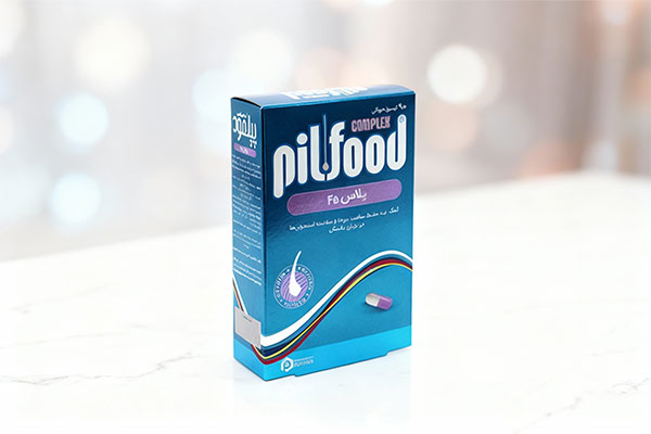 کپسول پیلفود کمپلکس پلاس 45 دارو درمان پارمیدا روی سطح مرمر سفید