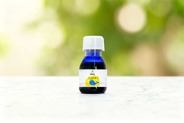 تصویر شربت کاف استاپ باریج اسانس روی سطح مرمر سفید