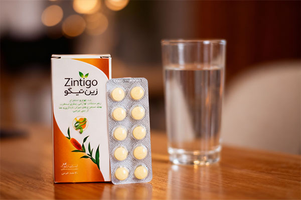 قرص زین تیگو ایران داروک کنار لیوان آب