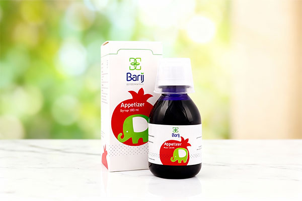 شربت اشتها آور بزرگسالان باریج اسانس روی سطح مرمر سفید